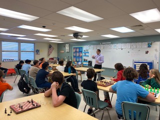 Students learning about chess